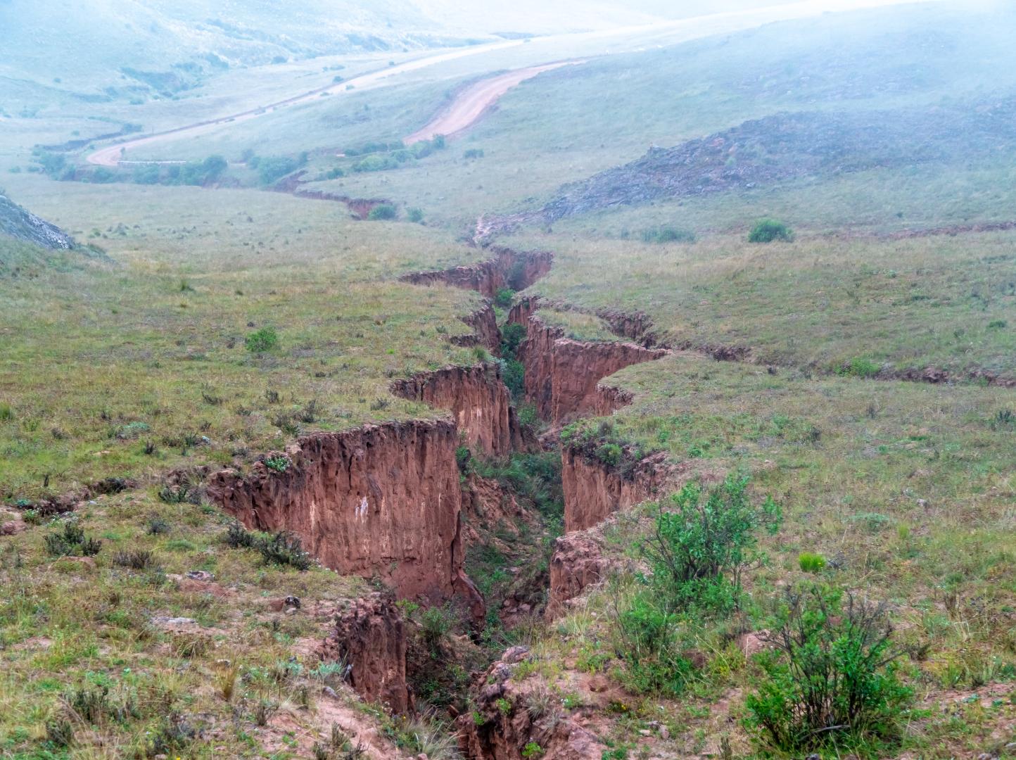 A large crack in the ground after seismic activity.