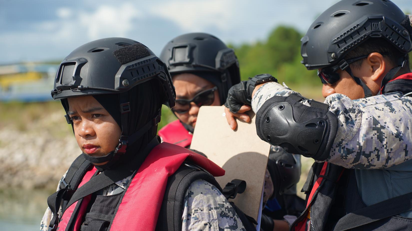 Officers from Malaysia’s Maritime Enforcement Agency (MMEA) take part in an exercise at the Visit, Board, Search, and Seizure training facility in Batam, Indonesia, on June 15, 2023.