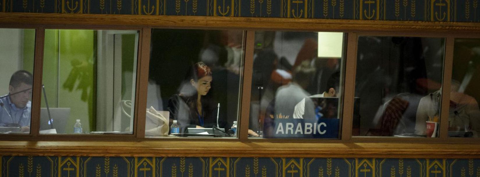 United Nations interpreters at work during a Security Council debate. Interpreters are one type of language professionals employed at the UN.