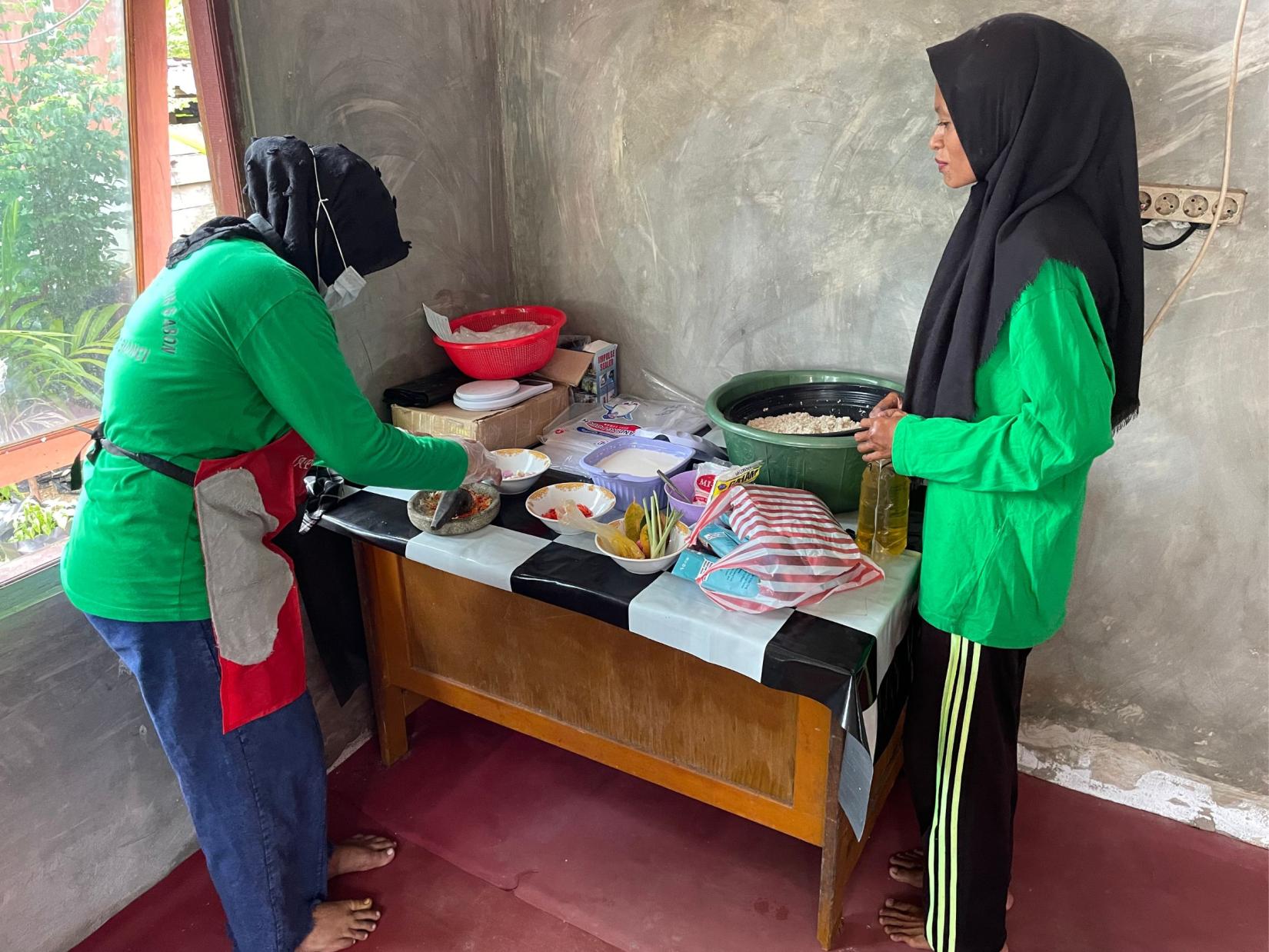 Two women cooking in a kitchen