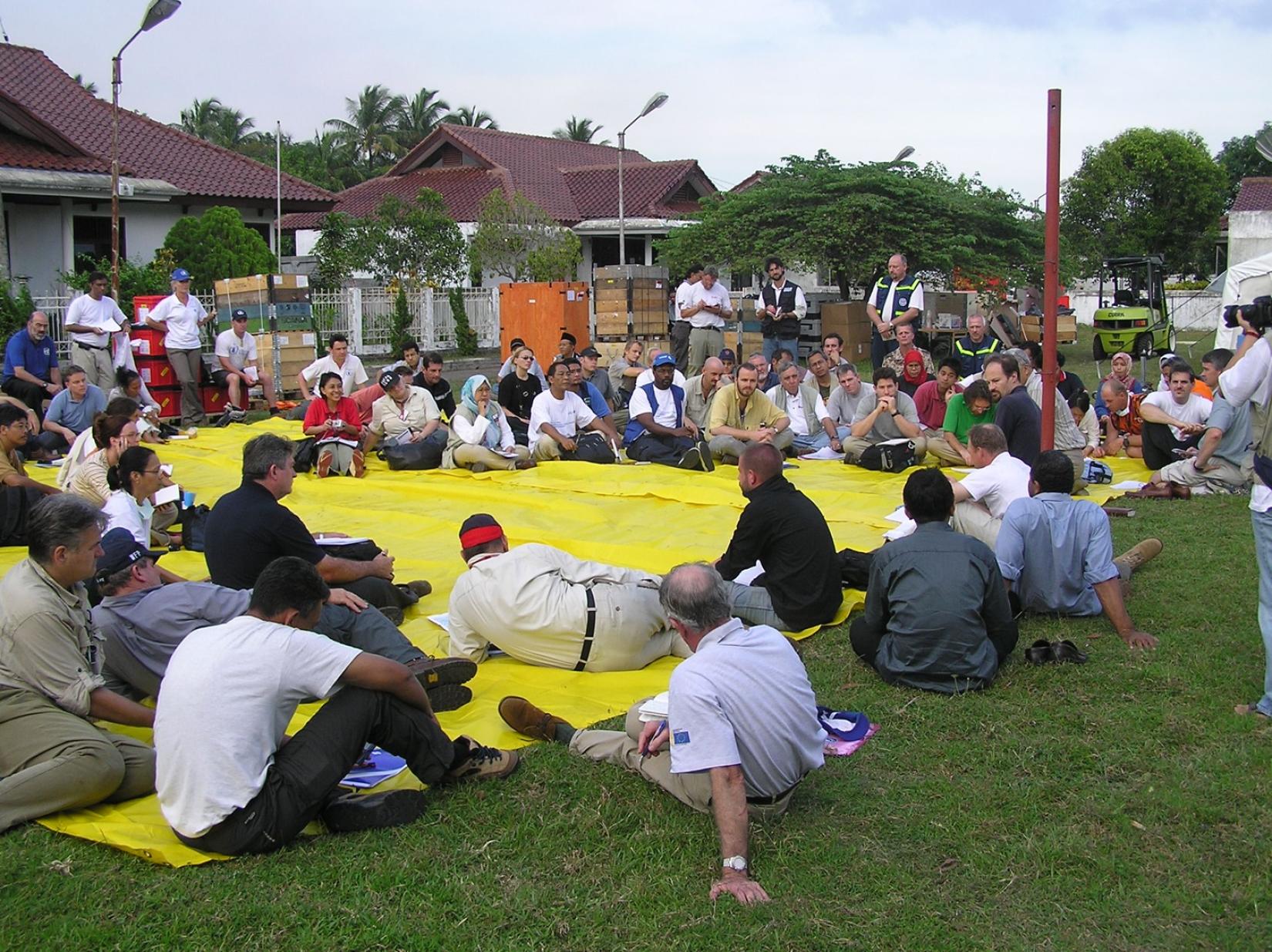 In 2004, following the devastating tsunami that struck the Indian Ocean region, the United Nations Office for the Coordination of Humanitarian Affairs (OCHA) took the initiative to organize a crucial coordination meeting in Banda Aceh, Indonesia. This meeting aimed to bring together a diverse array of stakeholders, including government representatives, non-governmental organizations (NGOs), international agencies, and local community leaders, to facilitate a comprehensive and effective response to the disas