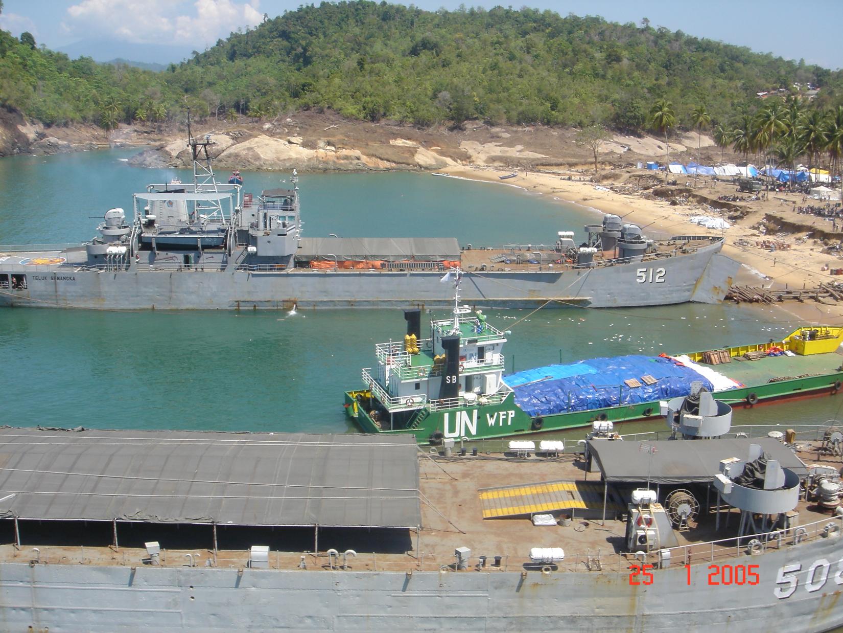 The World Food Programme (WFP) landing craft operation is underway, delivering vital food assistance to Calang, Aceh. This region was among the hardest hit by the Tsunami, and providing food supplies is a critical lifeline for the disaster victims. During tsunami operations, WFP operates a large number of logistics support services facilitating the delivery of critical humanitarian aid to the entire humanitarian community, for land operations under the UN Joint Logistics Centre (UNJLC), air operations under