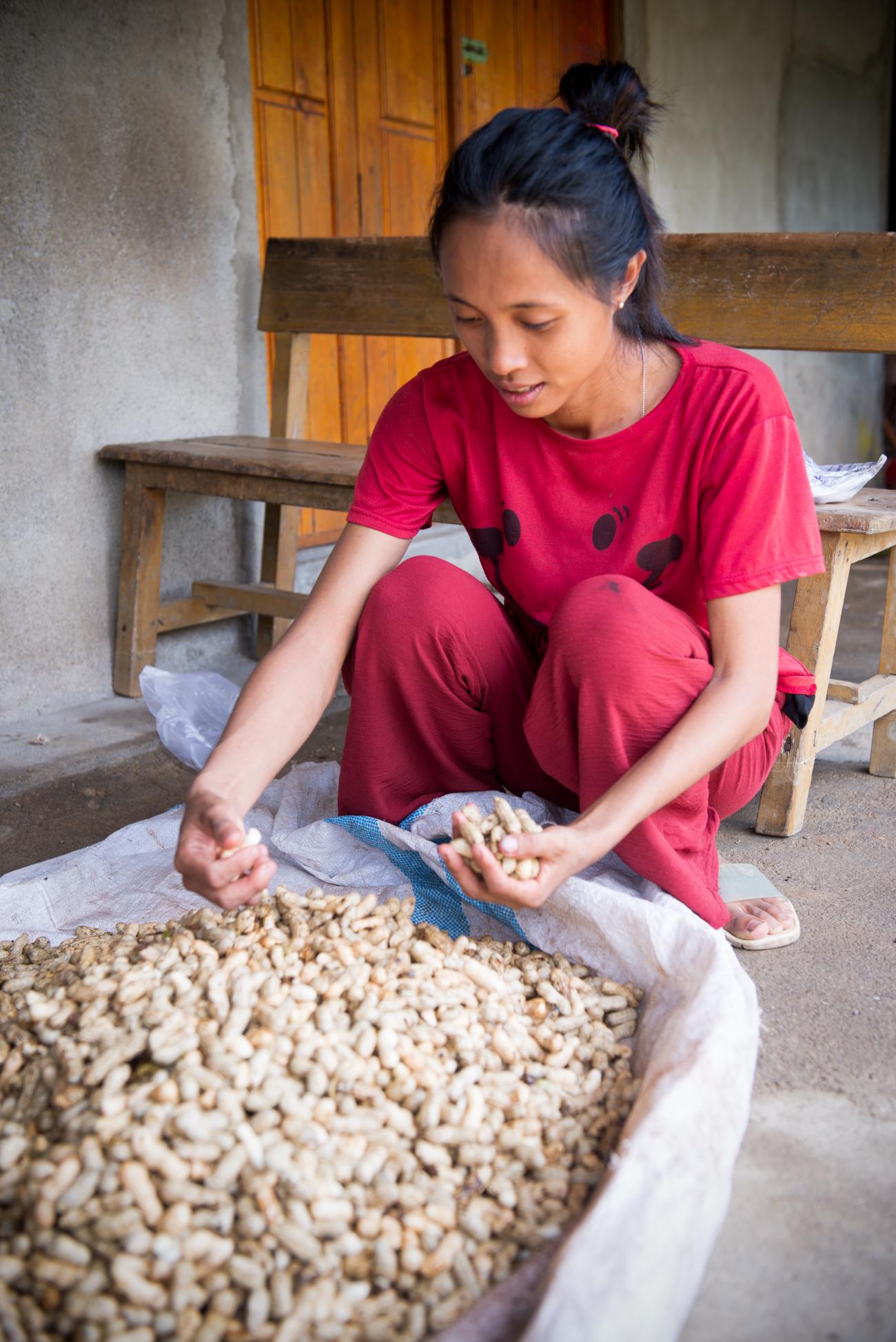 A woman in red managing peanuts