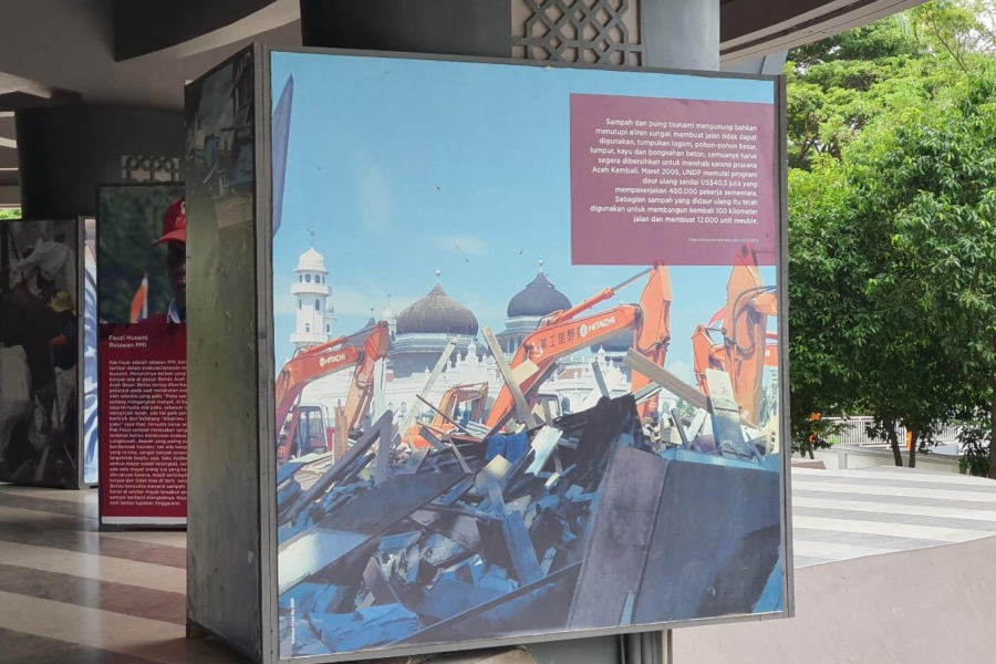 One of the documentations from Aceh Tsunami depicting a mosque and building ruins is showcased at the Aceh Tsunami Museum.