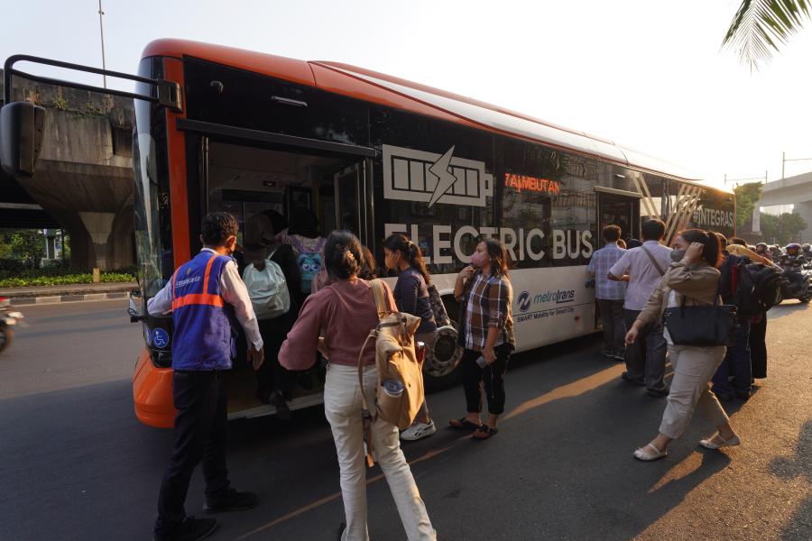 Passenger using electric bus