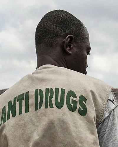 A staff member of the Liberia National Police Anti-Drug Squad reviews the municipal dump outside Monrovia, Liberia, where they are burning nearly 400 kg of marijuana and other drugs that were confiscated between 2011 and 2012.