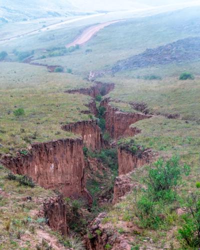 A large crack in the ground after seismic activity.
